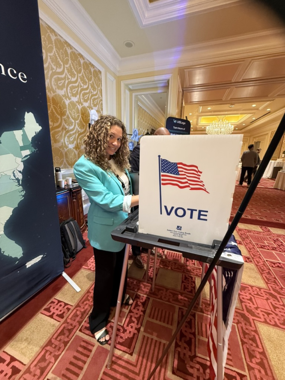 A USLege teammate at the voting booth in the USLege conference exhibit
