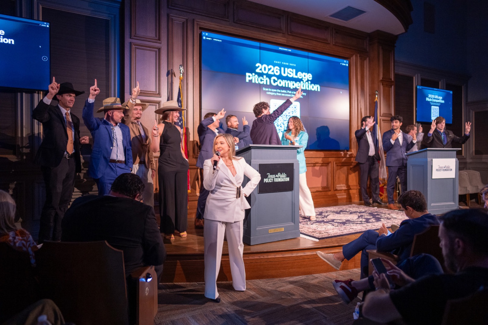 The USLege team on stage at the 2026 USLege Pitch Competition